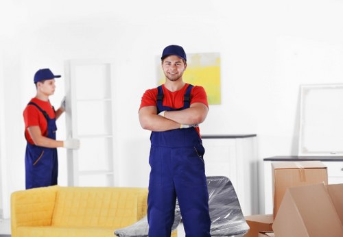 Professional office movers handling furniture