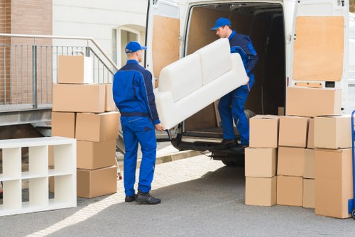 Professional movers from Alans Removal handling furniture