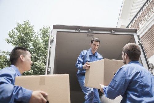 Professional movers assisting with packing